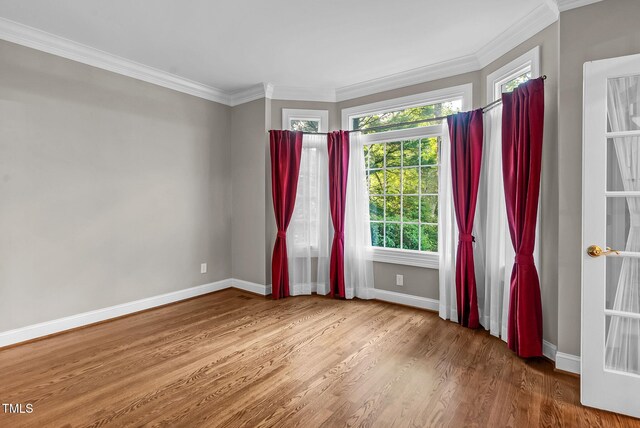 105 Bathgate Ln, Cary, NC 27513 - unfurnished room featuring wood finished floors and crown molding