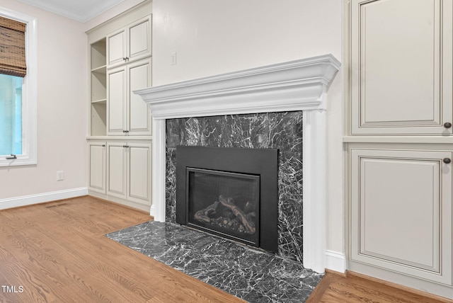 105 Bathgate Ln, Cary, NC 27513 - detailed view of wood finished floors, a high end fireplace, and ornamental molding