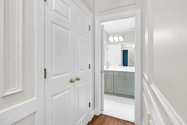 105 Bathgate Ln, Cary, NC 27513 - corridor featuring a chandelier and dark wood-type flooring