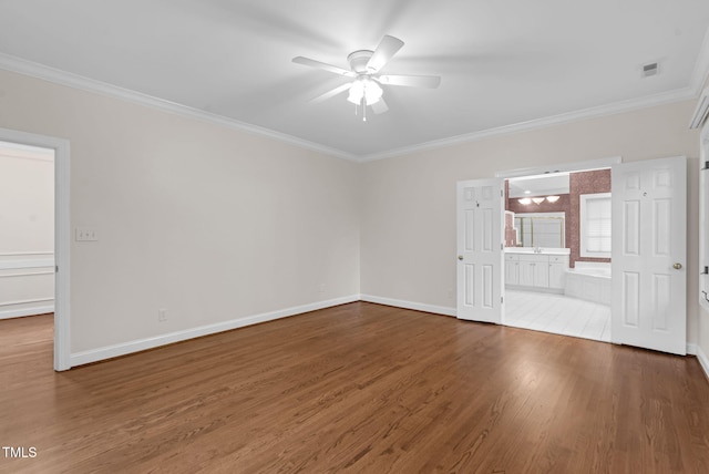 105 Bathgate Ln, Cary, NC 27513 - spare room featuring ornamental molding, wood finished floors, and ceiling fan