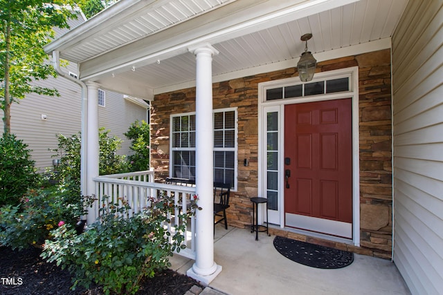 8205 Rolling Glenn Dr, Raleigh, NC 27616 - doorway to property with a porch and stone siding