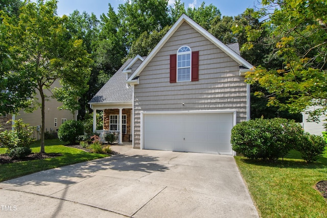 8205 Rolling Glenn Dr, Raleigh, NC 27616 - traditional home featuring a garage, a front yard, driveway, and a shingled roof