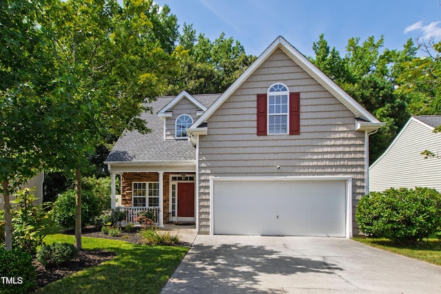 8205 Rolling Glenn Dr, Raleigh, NC 27616 - traditional-style home with driveway, a garage, covered porch, a shingled roof, and stone siding