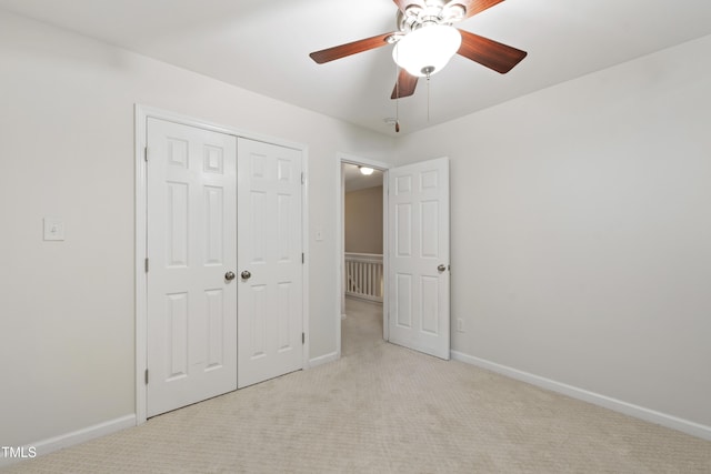 8205 Rolling Glenn Dr, Raleigh, NC 27616 - unfurnished bedroom with light colored carpet, a closet, and ceiling fan
