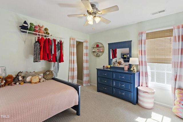 8205 Rolling Glenn Dr, Raleigh, NC 27616 - bedroom featuring light carpet and ceiling fan