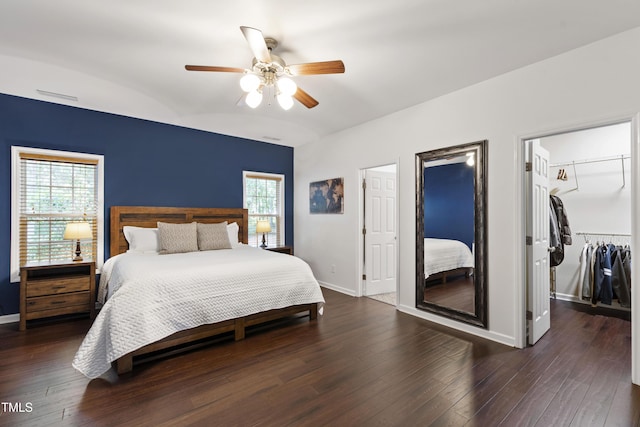 8205 Rolling Glenn Dr, Raleigh, NC 27616 - bedroom with wood finished floors, a walk in closet, a ceiling fan, and a closet