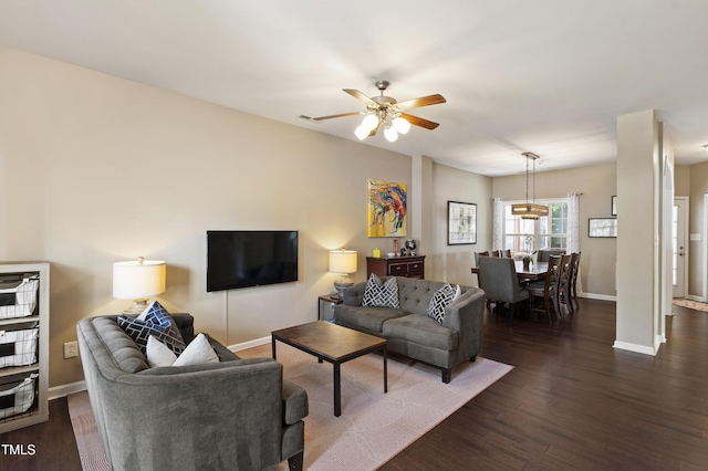 8205 Rolling Glenn Dr, Raleigh, NC 27616 - living area featuring a ceiling fan and dark wood-style flooring