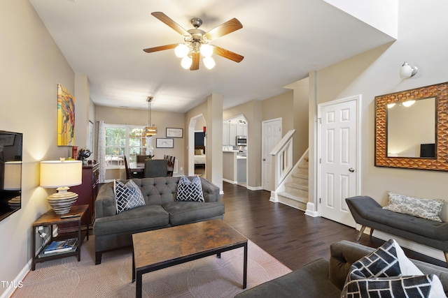 8205 Rolling Glenn Dr, Raleigh, NC 27616 - living area featuring ceiling fan, wood finished floors, and stairs