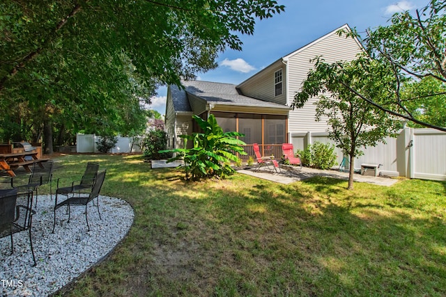 8205 Rolling Glenn Dr, Raleigh, NC 27616 - fenced backyard featuring a patio and a sunroom