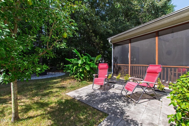 8205 Rolling Glenn Dr, Raleigh, NC 27616 - view of green lawn featuring a patio and a sunroom