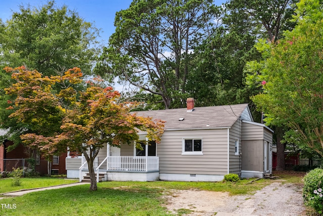208 Fairview Ave SW, Wilson, NC 27893 - view of front of house with covered porch, crawl space, roof with shingles, and a chimney