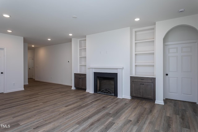 6069 Jones Cir, Sanford, NC 27332 - unfurnished living room featuring wood finished floors, built in shelves, a fireplace, and recessed lighting