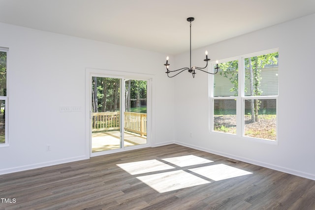 6069 Jones Cir, Sanford, NC 27332 - unfurnished room featuring a chandelier and dark wood-type flooring