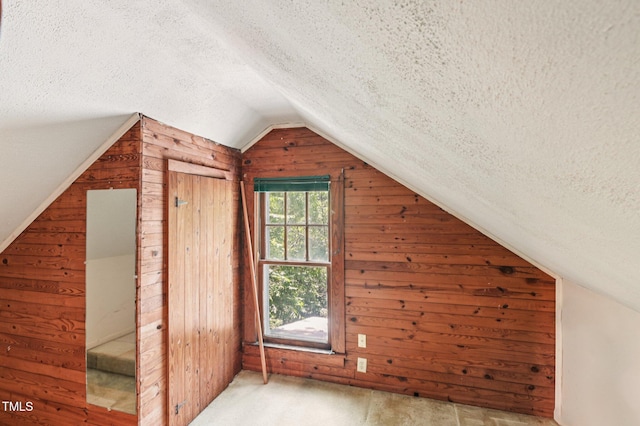 711 W Club Blvd, Durham, NC 27701 - additional living space featuring wood walls, a textured ceiling, and lofted ceiling