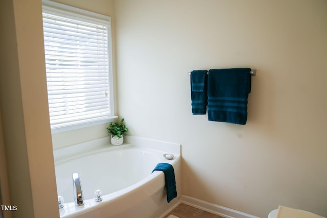 3423 Van Hessen Dr, Raleigh, NC 27614 - full bathroom featuring a garden tub and baseboards