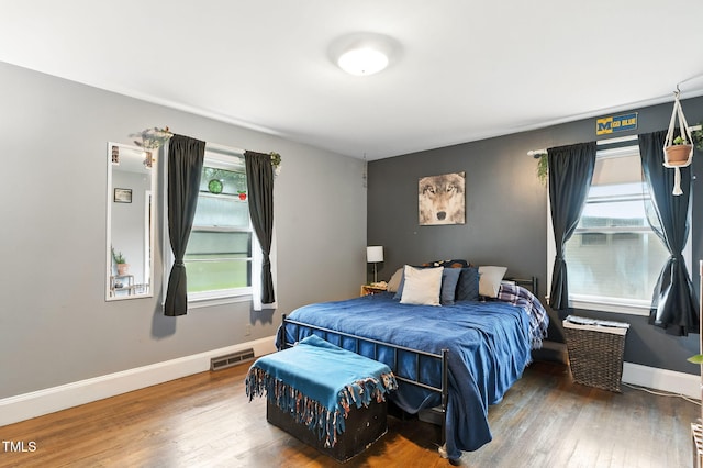 1015 S 1st St, Smithfield, NC 27577 - bedroom featuring multiple windows and wood finished floors
