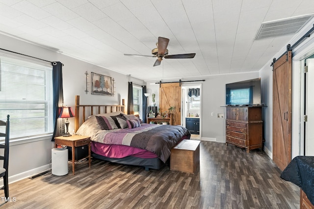 1015 S 1st St, Smithfield, NC 27577 - bedroom with a barn door, wood finished floors, and multiple windows