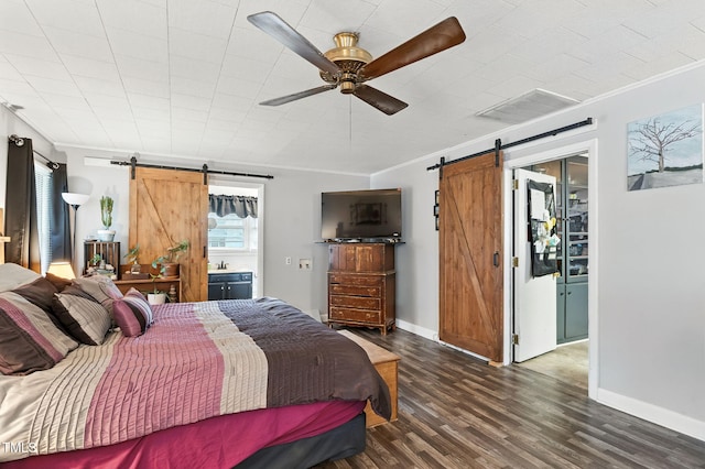 1015 S 1st St, Smithfield, NC 27577 - bedroom featuring a barn door, ornamental molding, wood finished floors, and ceiling fan