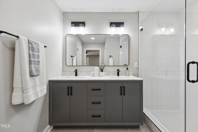 1609 Falls Ct, Raleigh, NC 27615 - full bath with a shower stall, double vanity, and a ceiling fan
