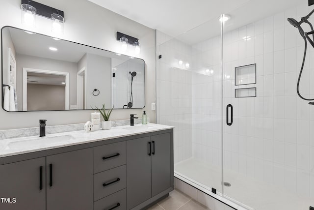 1609 Falls Ct, Raleigh, NC 27615 - full bath featuring a stall shower, double vanity, and tile patterned floors
