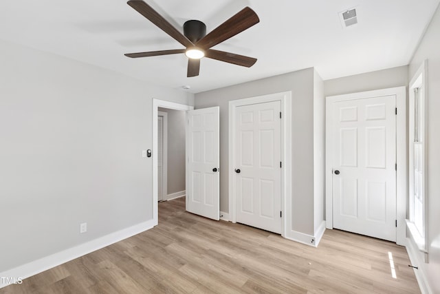 1609 Falls Ct, Raleigh, NC 27615 - unfurnished bedroom featuring light wood-type flooring, a ceiling fan, and a closet