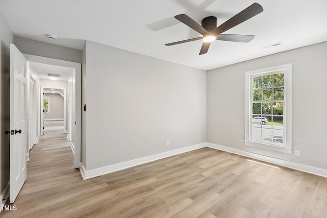 1609 Falls Ct, Raleigh, NC 27615 - unfurnished room with light wood finished floors, ceiling fan, and a smoke detector