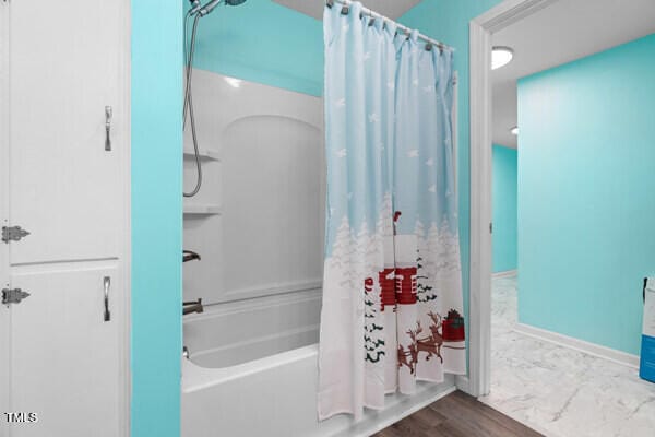 509 S Mckay Ave, Dunn, NC 28334 - bathroom with shower / tub combo with curtain