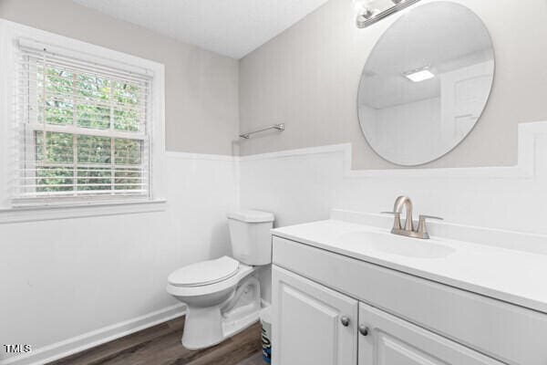 509 S Mckay Ave, Dunn, NC 28334 - bathroom featuring vanity and wood finished floors