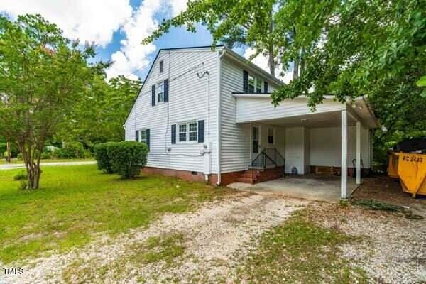 509 S Mckay Ave, Dunn, NC 28334 - view of home's exterior with crawl space, driveway, and a yard