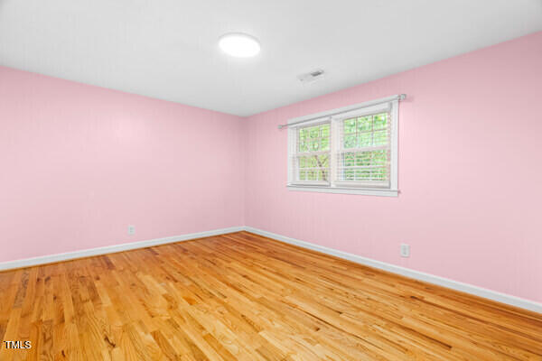 509 S Mckay Ave, Dunn, NC 28334 - empty room featuring light wood finished floors and baseboards