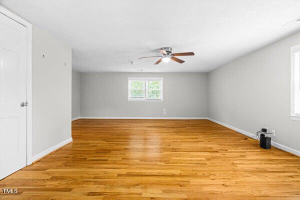 509 S Mckay Ave, Dunn, NC 28334 - spare room featuring ceiling fan and light wood-type flooring