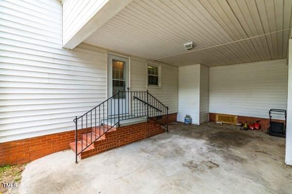 509 S Mckay Ave, Dunn, NC 28334 - view of patio / terrace featuring an attached carport