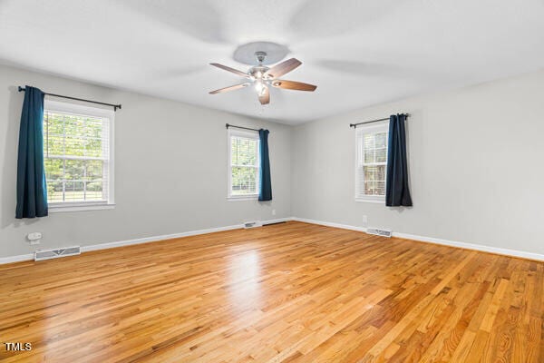 509 S Mckay Ave, Dunn, NC 28334 - spare room with light wood finished floors and ceiling fan