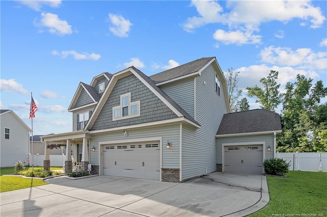 123 Sorrel Ct, Raeford, NC 28376 - view of front of property with concrete driveway, stone siding, and a shingled roof