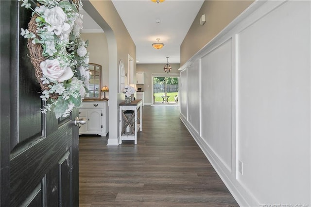 123 Sorrel Ct, Raeford, NC 28376 - corridor featuring dark wood-type flooring and arched walkways