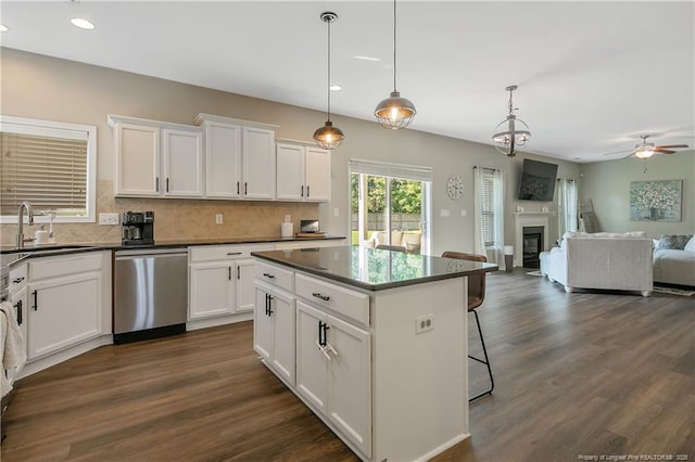 123 Sorrel Ct, Raeford, NC 28376 - kitchen with stainless steel dishwasher, ceiling fan, dark wood-style flooring, recessed lighting, and tasteful backsplash