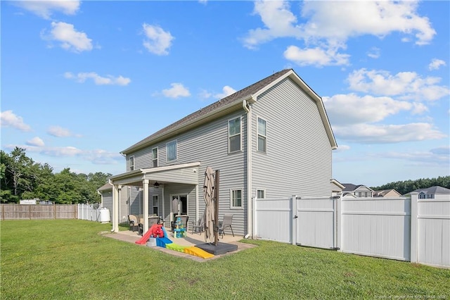 123 Sorrel Ct, Raeford, NC 28376 - back of house with ceiling fan, a patio area, and a fenced backyard