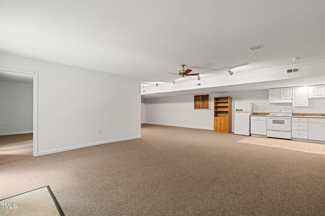 601 Wofford Rd, Durham, NC 27707 - unfurnished living room featuring light carpet and a ceiling fan
