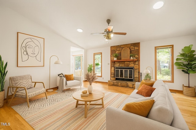 601 Wofford Rd, Durham, NC 27707 - living area featuring light wood-type flooring, a ceiling fan, a stone fireplace, and vaulted ceiling