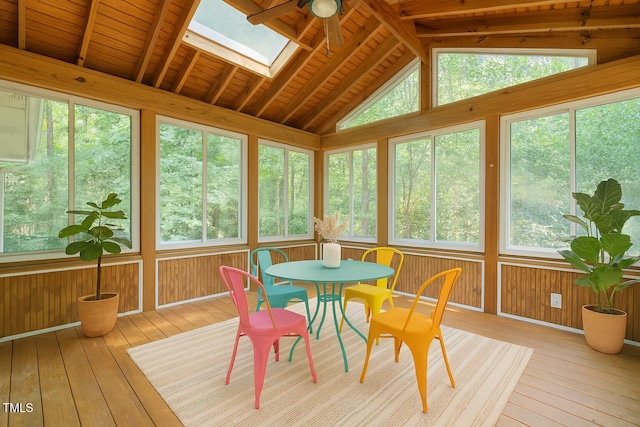 601 Wofford Rd, Durham, NC 27707 - sunroom featuring wood-type flooring, vaulted ceiling, a skylight, a wooden deck, and wood walls