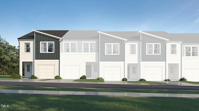 3113 Vitner Dr, Durham, NC 27704 - view of front of home with board and batten siding and an attached garage