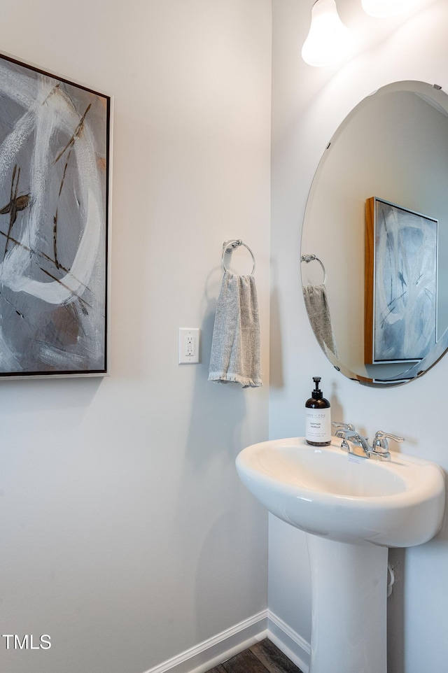 3113 Vitner Dr, Durham, NC 27704 - bathroom with baseboards and a sink