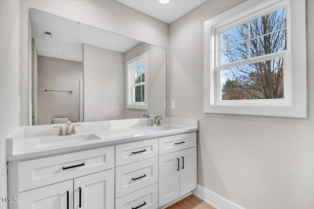 719 Force Rd, Goldsboro, NC 27534 - full bathroom featuring double vanity and baseboards