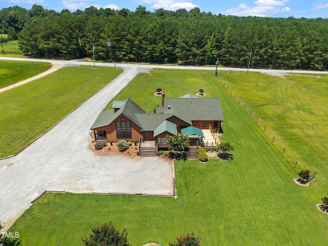view of subject property with a heavily wooded area