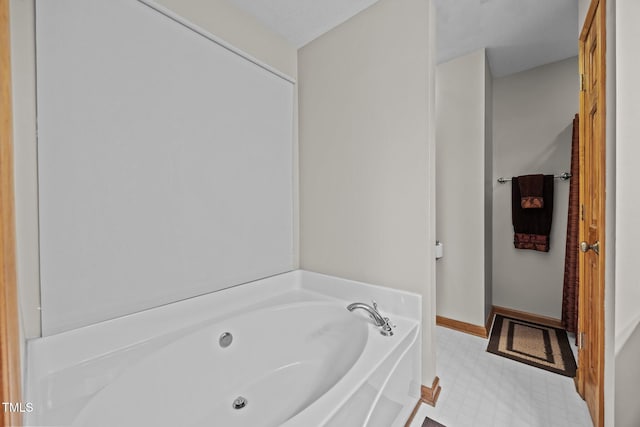 bathroom with a garden tub and tile patterned floors