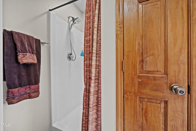 bathroom with a shower with shower curtain