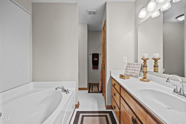 bathroom featuring a garden tub and vanity