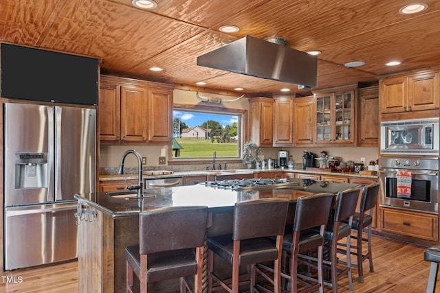 kitchen with appliances with stainless steel finishes, a center island with sink, wooden ceiling, brown cabinetry, and recessed lighting