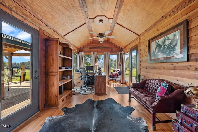 sunroom with wood ceiling, wooden walls, lofted ceiling, and wood finished floors