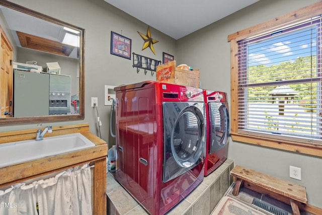 laundry area featuring independent washer and dryer and plenty of natural light